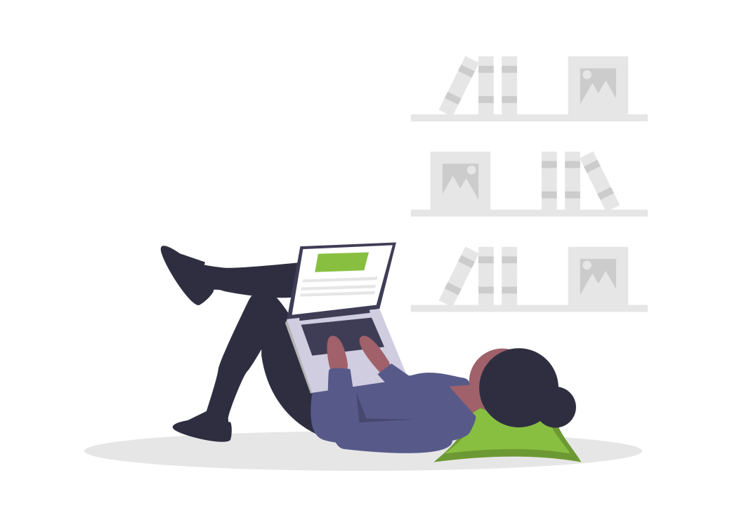man laying on the floor working carefree on his lapto